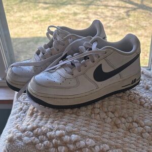 Nike White Low-Top Sneakers with Black Swoosh